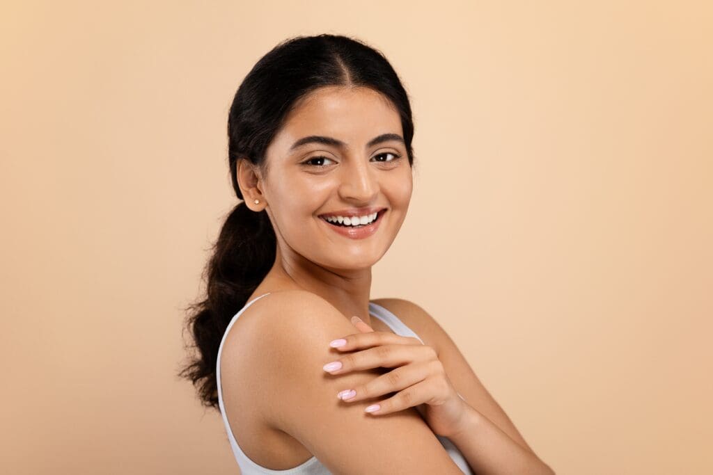 Woman with dark hair smiling at camera